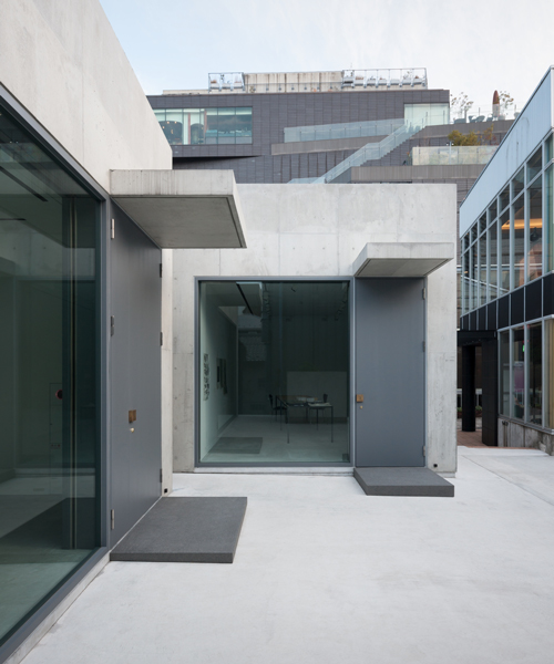 nobuo araki combines three concrete blocks into 'the mass' museum complex in tokyo