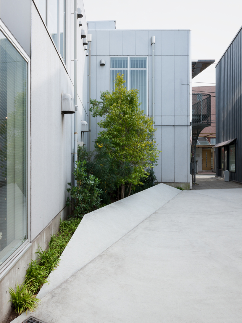 nobuo araki combines three concrete blocks into 'the mass' museum complex in tokyo
