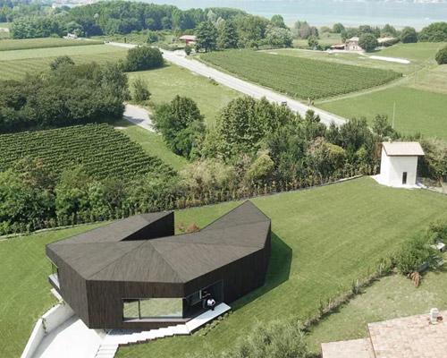 ARW associates connects claw-shaped house with its mountainous landscape in italy