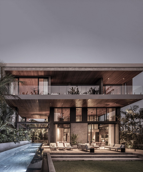 alexis dornier builds river house in bali cladding surfaces with reclaimed timber + local sandstone