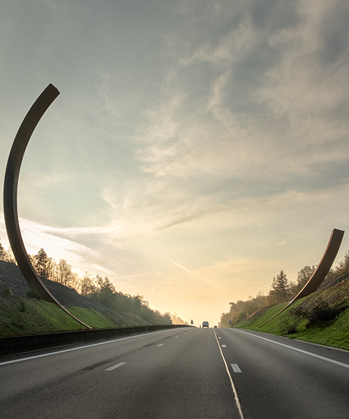bernar venet frames belgian motorway in monumental corten steel l'arc majeur