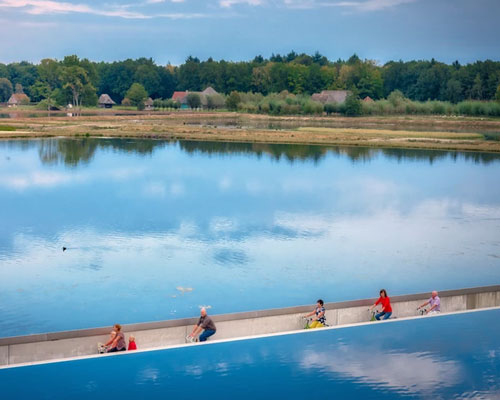 ‘cycling through water’ provides a unique experience of belgium's lake district