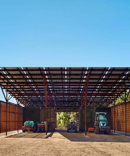 clayton & little situate off-grid barn of perforated steel among california vineyard