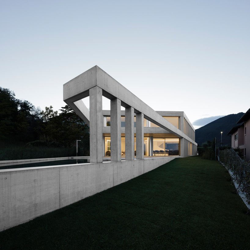 DF_DC's concrete villa in comano, switzerland, is conceived as an ...