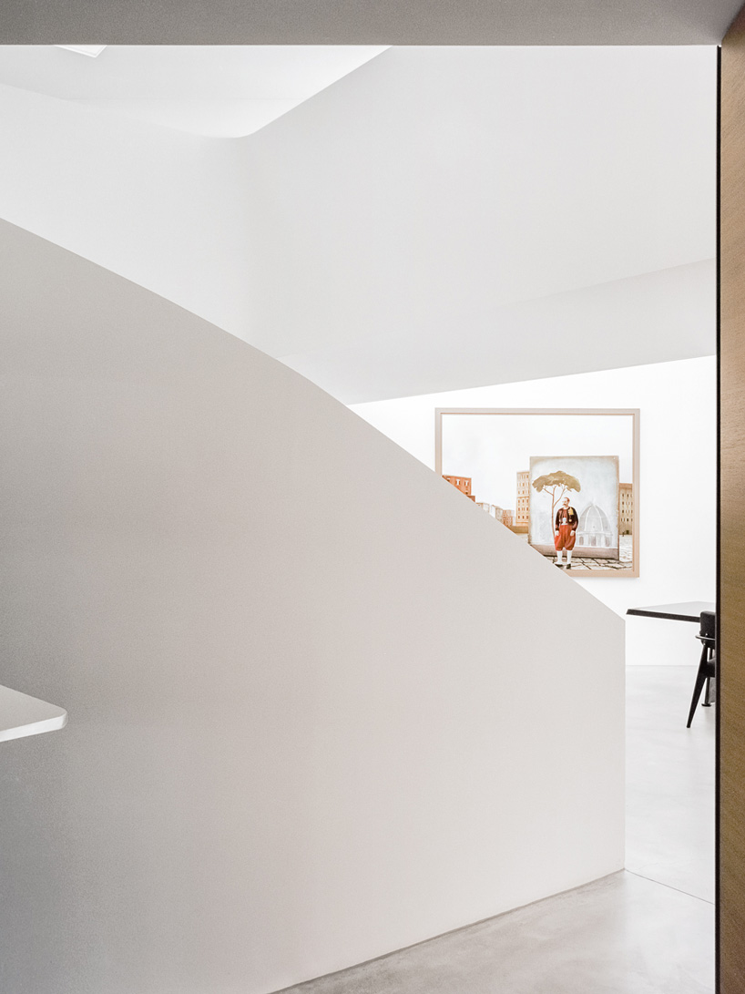 DF_DC's concrete villa in comano, switzerland, is conceived as an inhabited wall