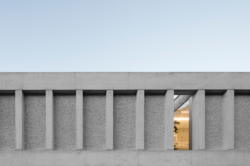 DF_DC's concrete villa in comano, switzerland, is conceived as an inhabited wall