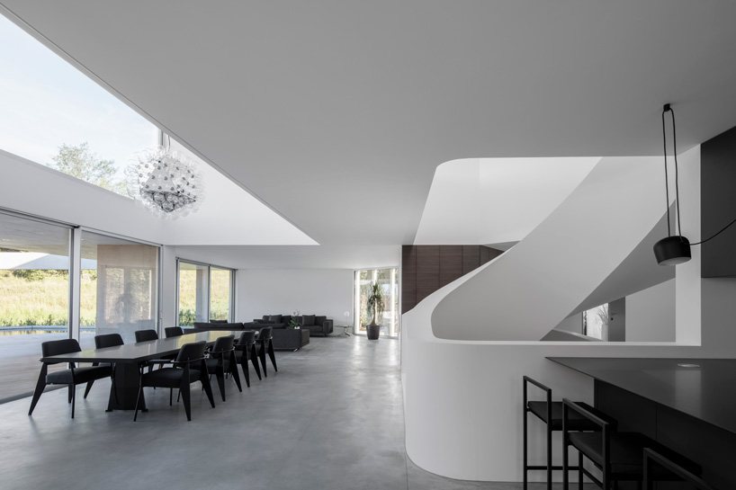 DF_DC concrete villa in comano, switzerland, is conceived as an inhabited wall