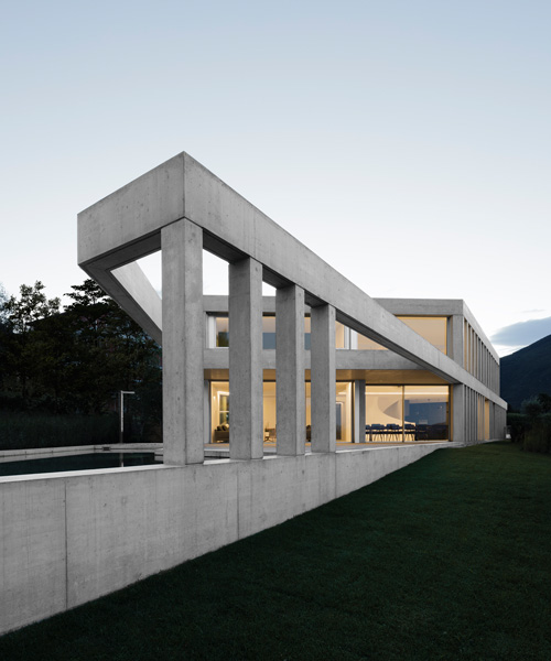 DF_DC's concrete villa in comano, switzerland, is conceived as an inhabited wall