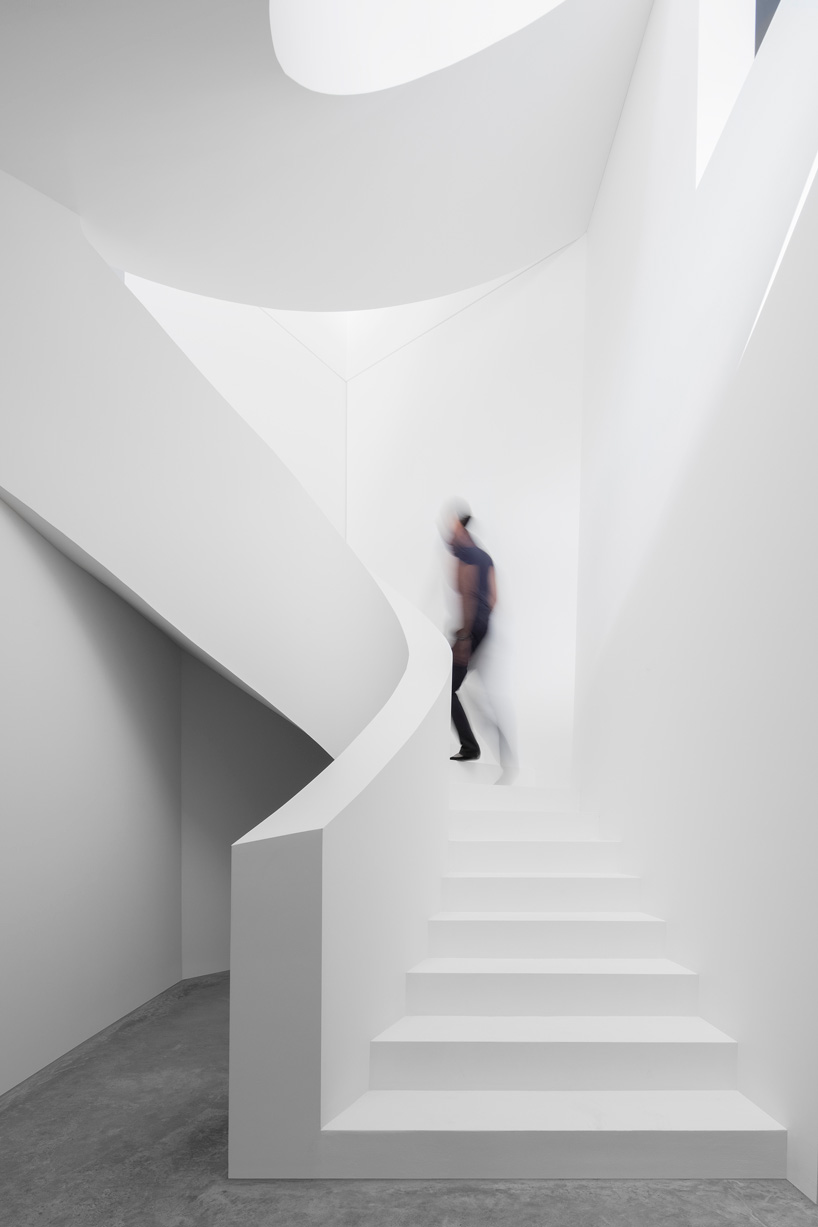 DF_DC's concrete villa in comano, switzerland, is conceived as an inhabited wall