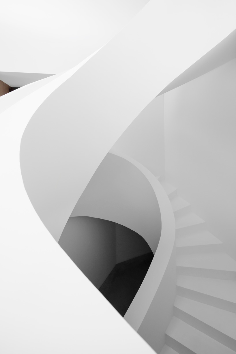 DF_DC's concrete villa in comano, switzerland, is conceived as an inhabited wall