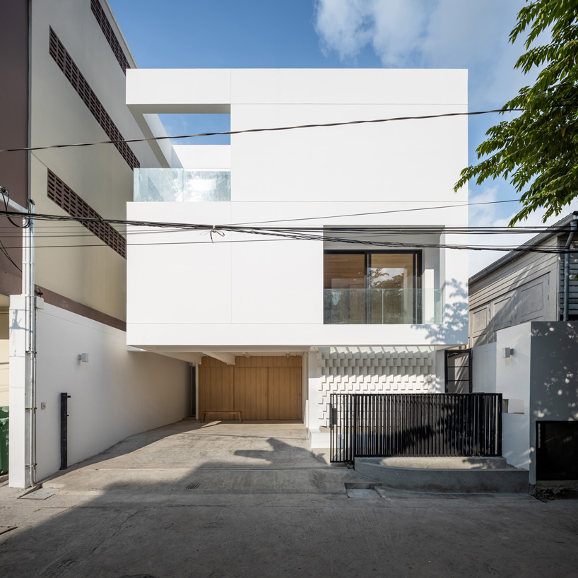 fattstudio wraps ‘bangson’ house in bangkok in white shell of concrete + brick