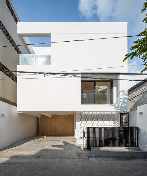 fattstudio wraps 'bangson' house in bangkok in white shell of concrete + brick