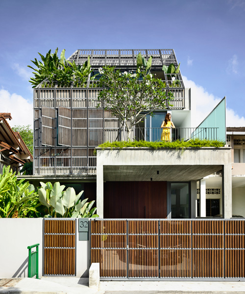 HYLA architects wraps house in singapore in operable façade of timber screens
