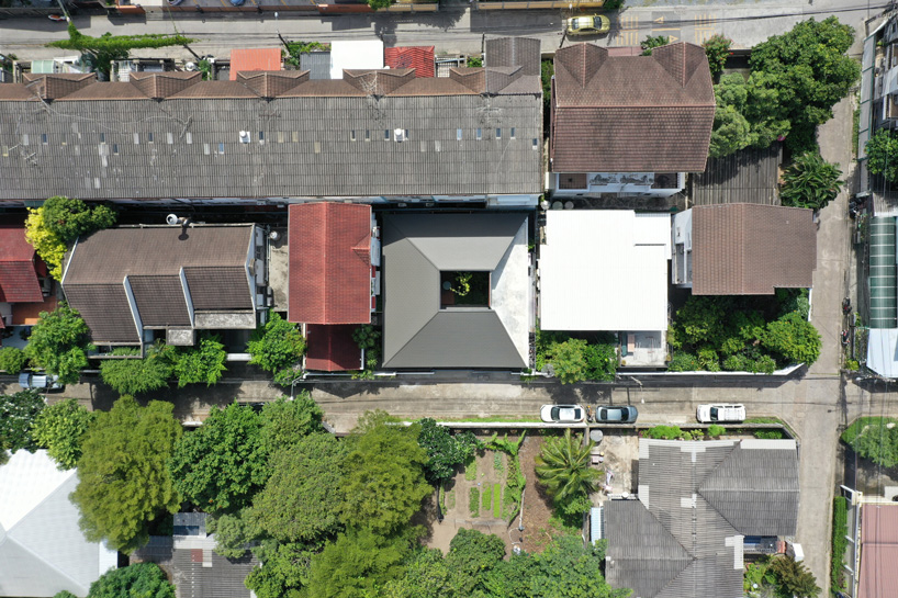 looklen architects builds the roof house in thailand around central open courtyard