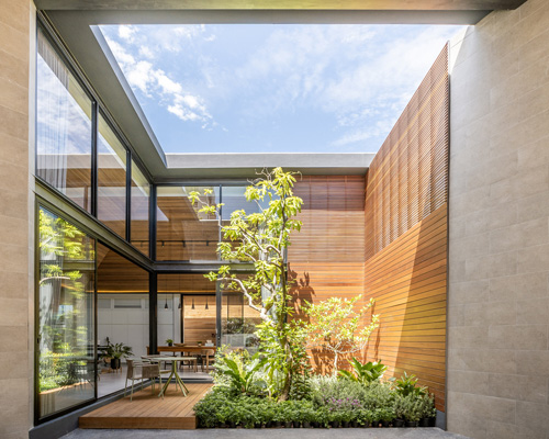 looklen architects builds the roof house in thailand around a central open courtyard
