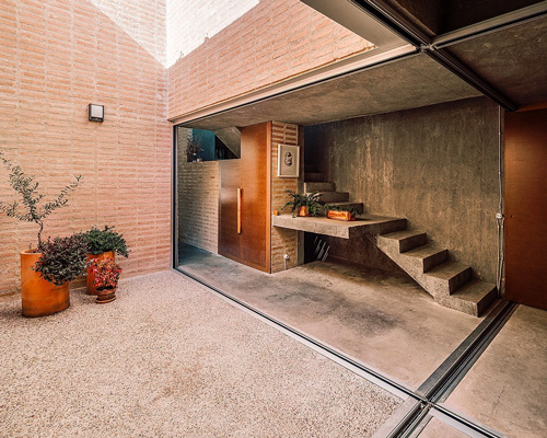 malu de miguel splits brick + concrete family house in madrid in two separate pavilions
