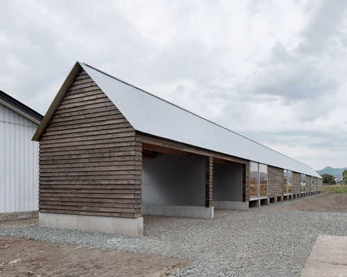 motoki ishikawa architect and associates constructs 50-meter-long wooden house in japan