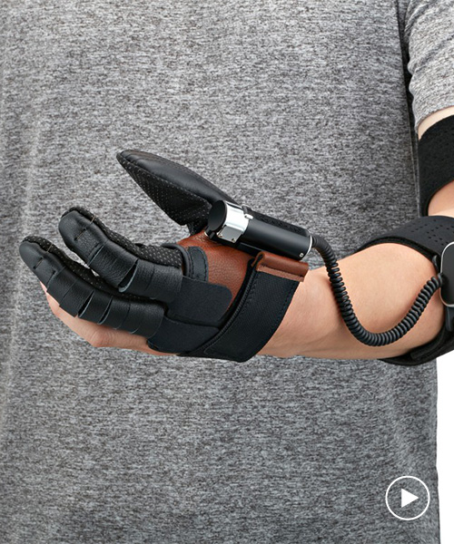the neomano robotic glove powers people with hand paralysis