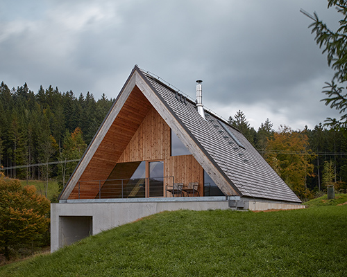 weekend house by pavel míček burrows into czech republic's beskydy mountain landscape