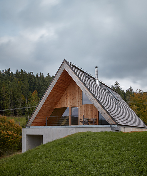 weekend house by pavel míček burrows into czech republic's beskydy mountain landscape
