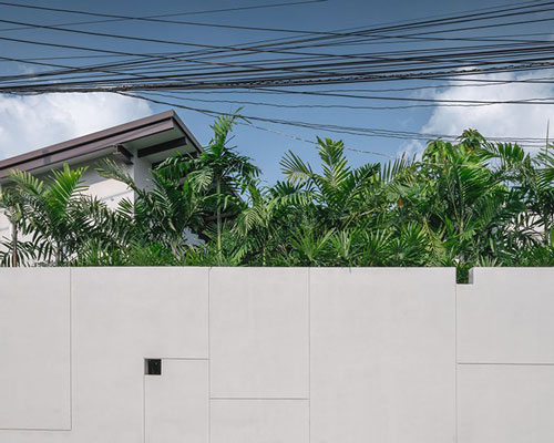 wooden accents and a central courtyard bring nature into house in thailand by anonym studio