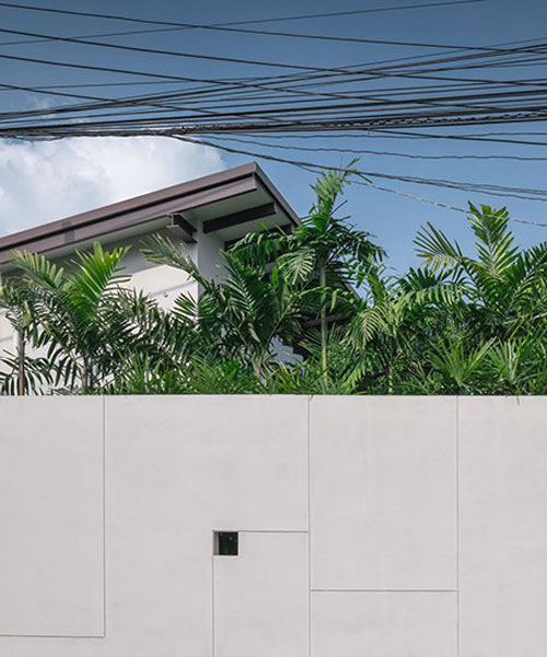 wooden accents and a central courtyard bring nature into house in thailand by anonym studio