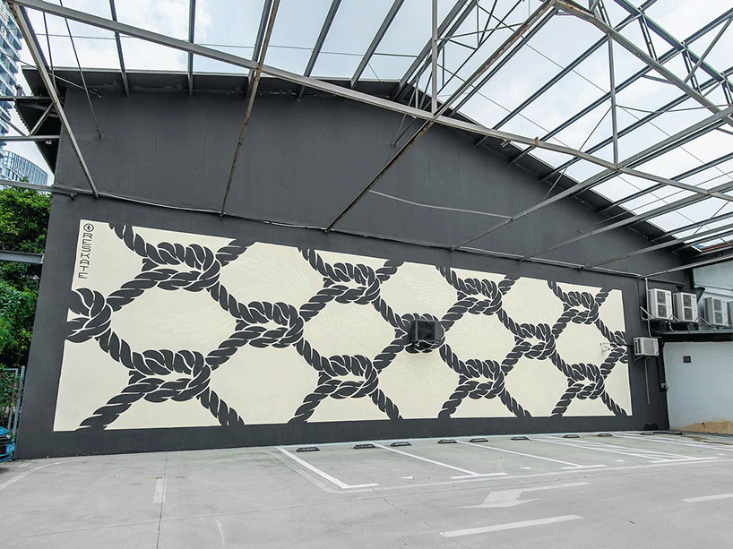 reskate studio unveils three glow-in-the-dark street murals with hidden messages