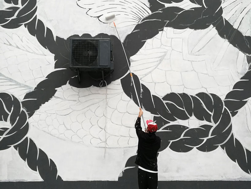 reskate studio unveils three glow-in-the-dark street murals with hidden messages