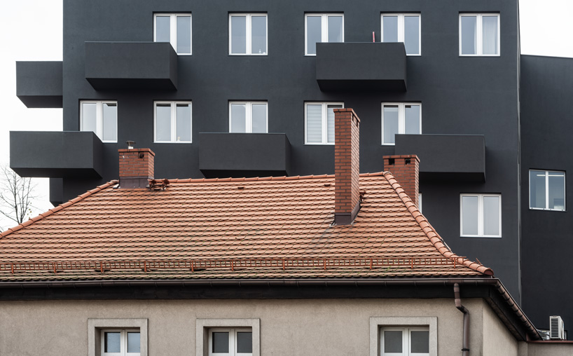 balconies protrude from KWK promes' apartment block in poland