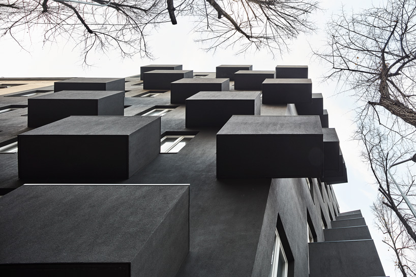 balconies protrude from KWK promes' apartment block in poland