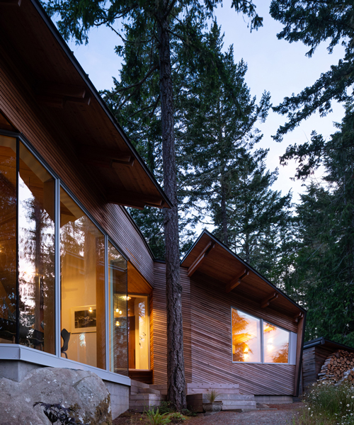 campos studio embeds the sooke house within the forest of a rocky hill in canada