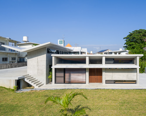 studio monaka tops concrete 'house om' in japan with a V-shaped roof