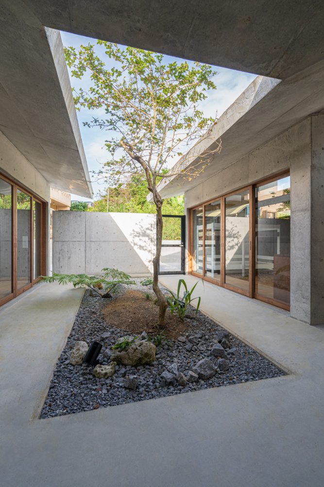 studio monaka tops concrete 'house om' in japan with a V-shaped roof