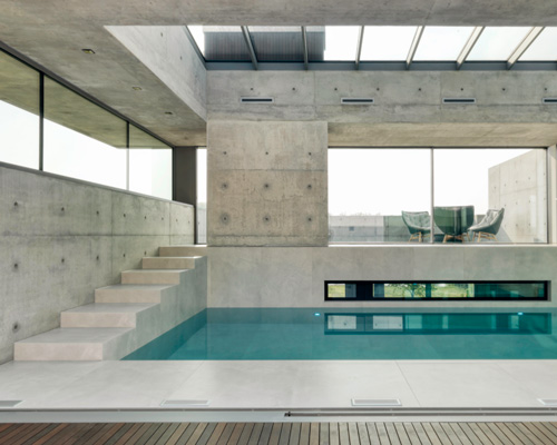 dreessen willemse architecten's concrete 'villa 22º' is nestled in a dutch hill