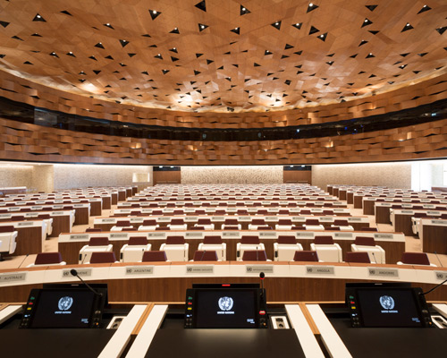 designed by PEIA associati, WOOD-SKIN covers UN assembly hall ceiling to resemble sand dune waves