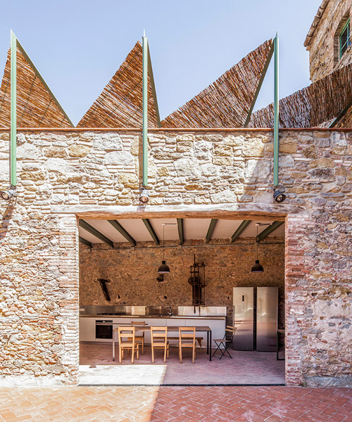 anna & eugeni bach transform former chocolate factory in spain into a warm, luminous oasis