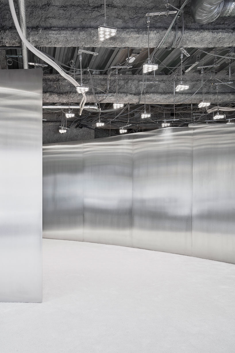 curved stainless steel defines arquitectura-g's acne studios store in nagoya, japan designboom