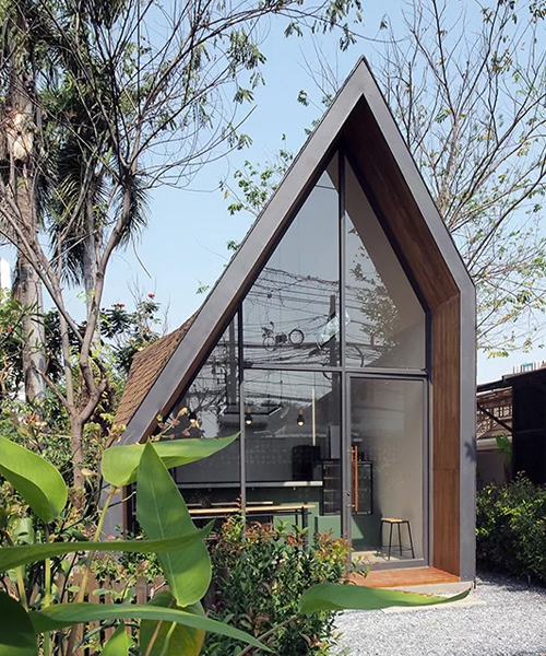 ASWA designs bangkok café with a steep gable roof and brown shingle cladding