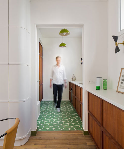 atelier pierre louis gerlier adds leafy green furniture and round doorways to house in paris