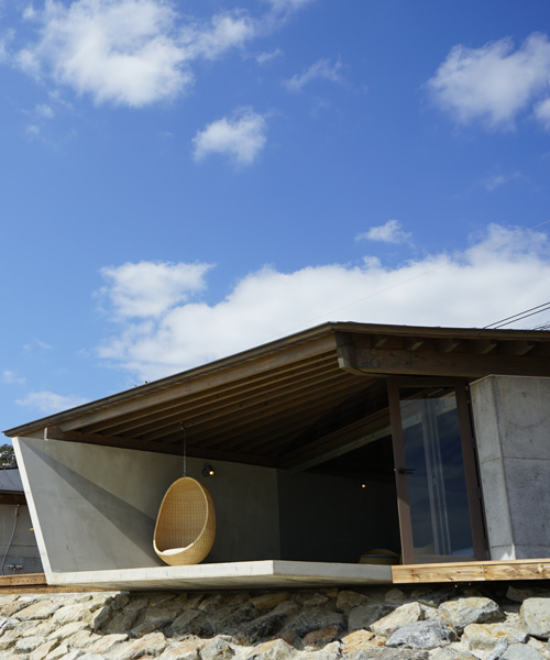 atelier tekuto + amami design firm build beachfront origami-like concrete villas in japan