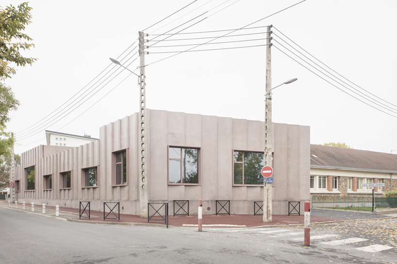 graal architecture clads jaurès recreation center in rose-stained concrete