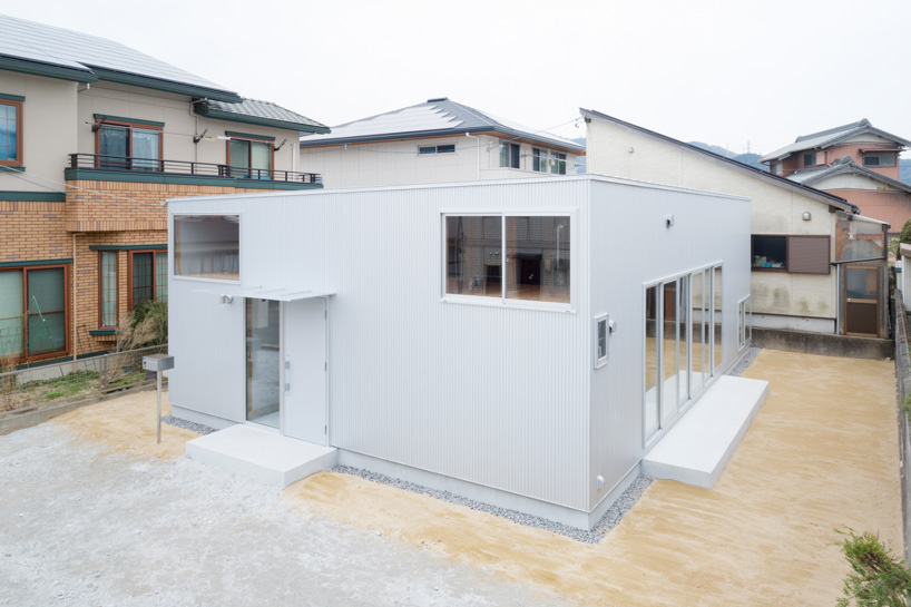 japanese wooden house by naoya kitamura is built around a central double-height space