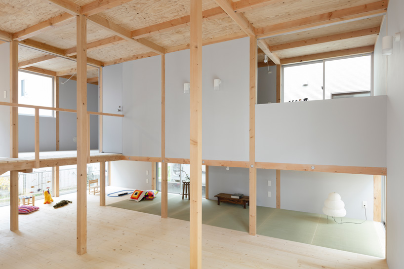japanese wooden house by naoya kitamura is built around a central double-height space