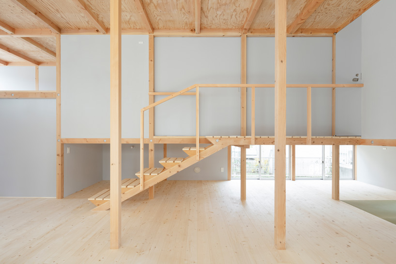 japanese wooden house by naoya kitamura is built around a central double-height space