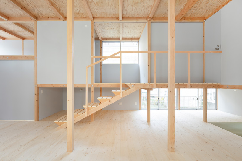 japanese wooden house by naoya kitamura is built around a central double-height space
