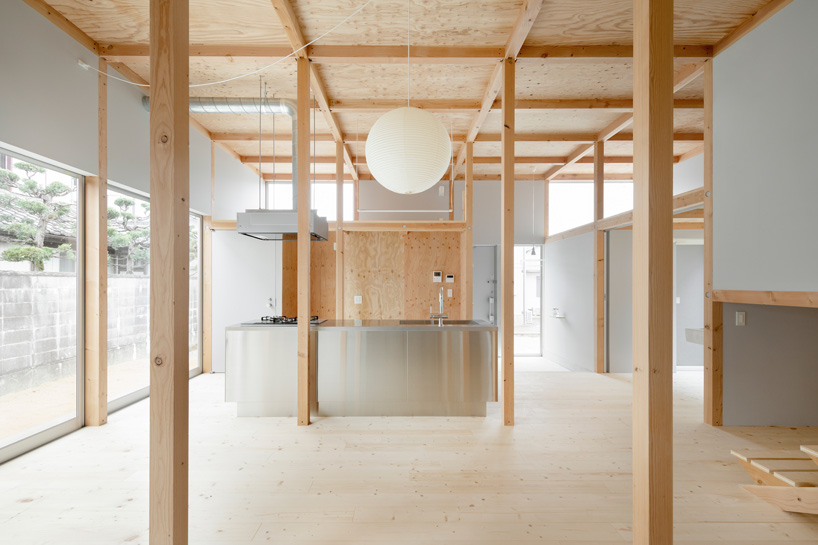 japanese wooden house by naoya kitamura is built around a central double-height space