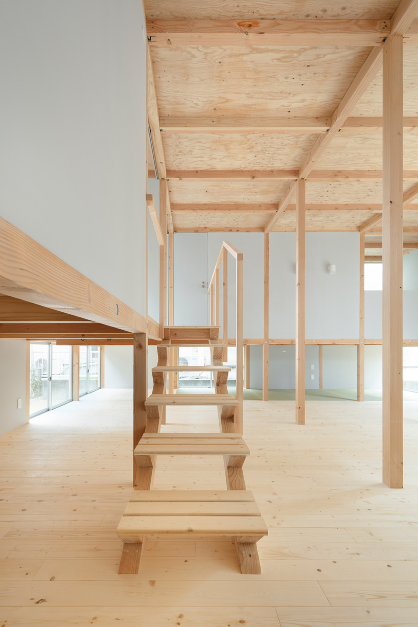 japanese wooden house by naoya kitamura is built around a central double-height space