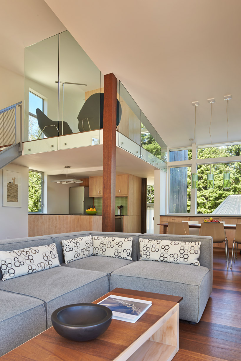 david coleman architecture designs cabin with angular forms and an illuminated facade in washington