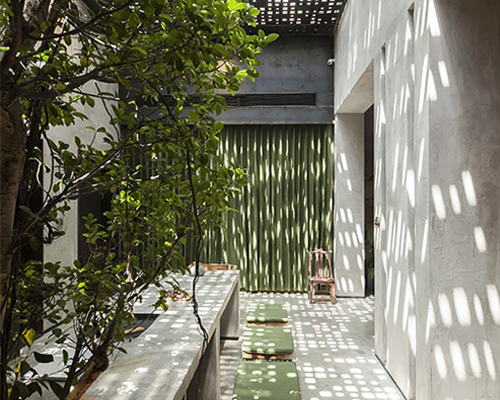 liang architecture's studio in china combines concrete and metal with greenery