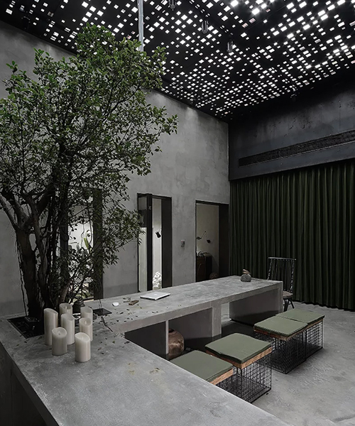 liang architecture's studio in china combines concrete and metal with greenery